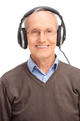 Vertical shot of a senior man with huge headphones