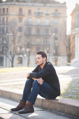 Obraz premium Young italian boy seated in the city