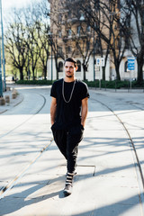 Young italian boy walking in the city