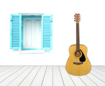 Guitar with window on cement wall