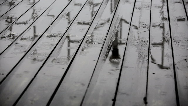 Rain and wooden floor at verandaRainwater on a wooden floor at terrace