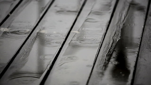 Rainwater on a wooden floor at terrace