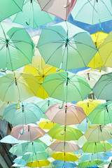 Fototapeta na wymiar Street decorated with colored umbrellas.