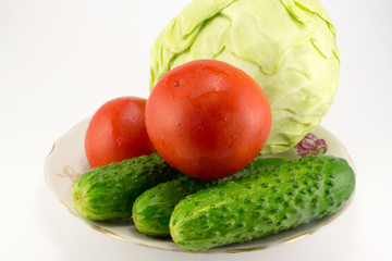 Cucumber and tomato with measuring