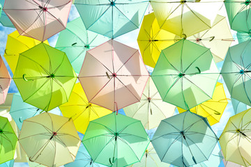 A lot of multicolored umbrellas under the sky