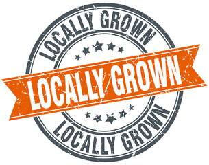 locally grown round orange grungy vintage isolated stamp