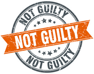 not guilty round orange grungy vintage isolated stamp