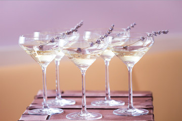 Glasses of white pink champagne decorated with lavender
