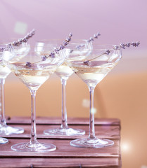 Glasses of white pink champagne decorated with lavender