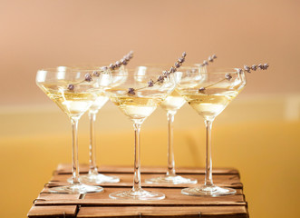 Glasses of white pink champagne decorated with lavender