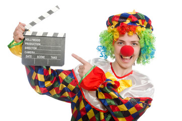 Clown with movie clapper isolated on white