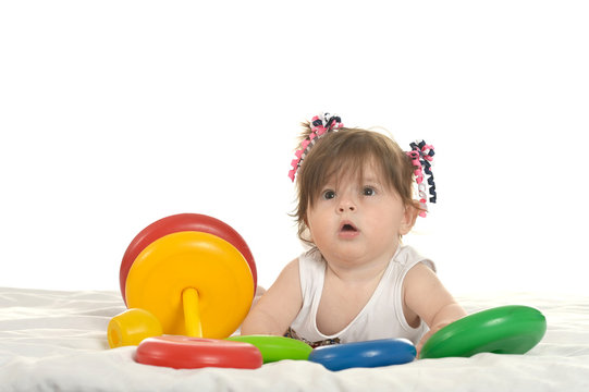 Baby girl playing with toys