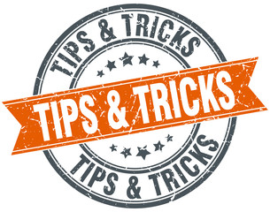 tips & tricks round orange grungy vintage isolated stamp