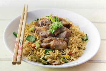 china noodle with garlic pork and vegetable, selective focus poi
