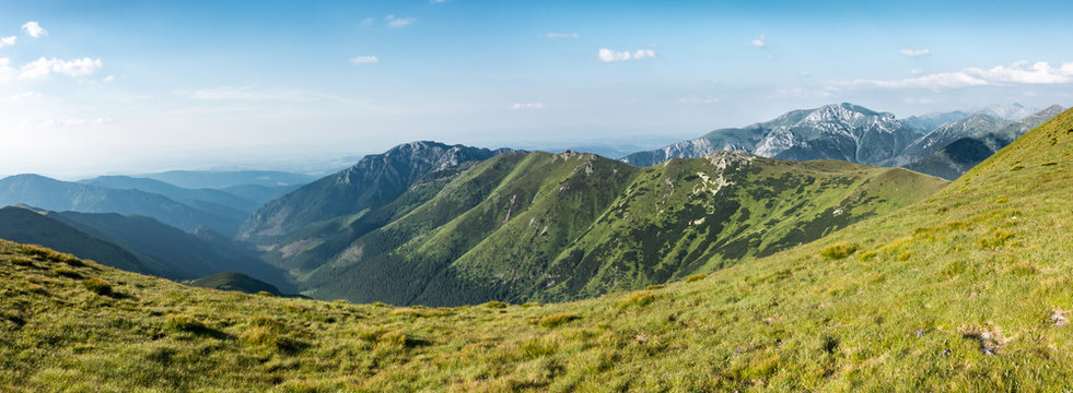 Panorama of amazing summer mountains under blue sky