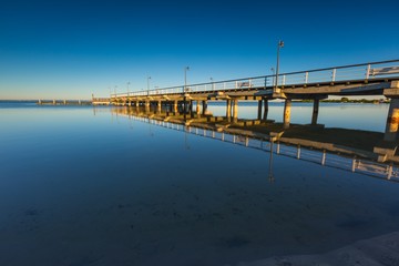Beautiful wooden pier on Baltic sea shore