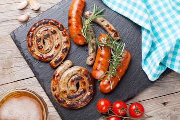 Grilled sausages and beer mug