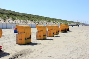 Roofed wicker beach chairs. Egmond aan Zee, North Sea, the Netherlands.