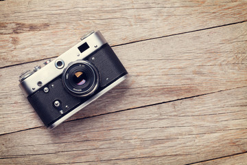 Vintage camera on wooden table