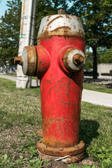 Fototapeta na wymiar Old Fire Hydrant. An old fire hydrant along a major road in Mississauga, Canada.