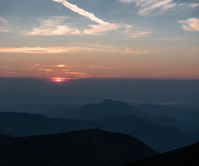 Mountain scenery at sunset with a series of peaks