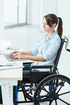 Young disabled businesswoman at work