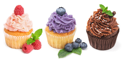 Collection of bright cupcakes with fresh berries isolated on whi