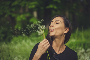 The beautiful woman with Dandelion