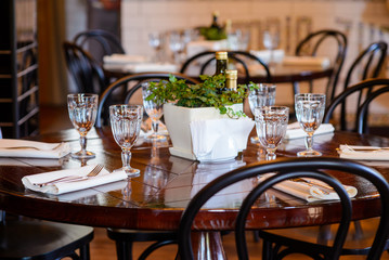 Catering table set service with empty glasses , napkin and table
