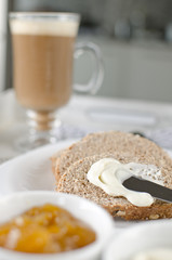 Healthy Breakfast: milk coffee with toasts and marmalade.