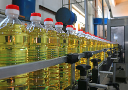 Sunflower Oil In The Bottle Moving On Production Line In A Factory