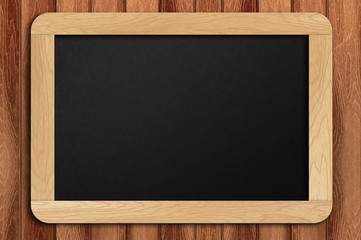 chalkboard hanging at the wall with copy space area