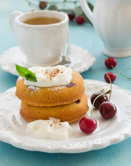 Clafoutis with cherries and whipped cream.