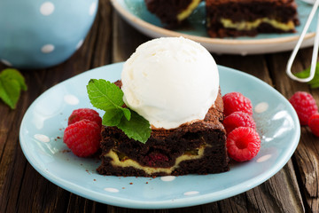 Brownie with raspberries and cheese filling.
