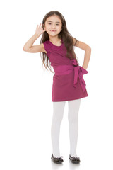 Fashionable little girl with long dark hair 