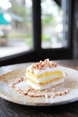 Mango cake with bean on wood background