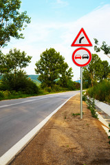 No overtake and three-cornered right turn sign
