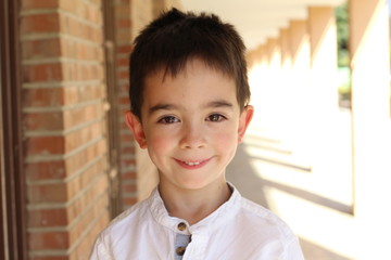 Happy young boy ready for school