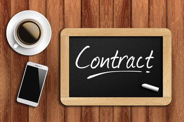 coffee, phone  and chalkboard with  word contract