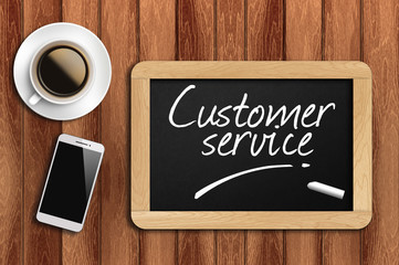 coffee, phone  and chalkboard with  word customer service