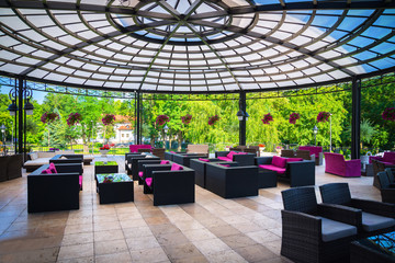 A large terrace with tables and benches for rest and relaxation
