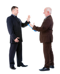 Young and old senior two businessman in suits argue and swear. Isolated on white background, Negative human emotion, facial expression