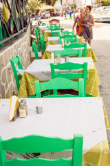 The empty chairs and tables of the restaurant