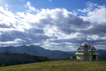Church in the mountains under the blue sky