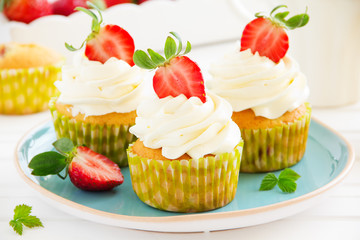 Muffins with fresh strawberries. Selective focus.