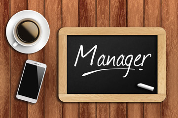 coffee, phone  and chalkboard with  word manager