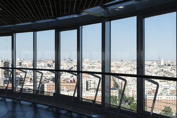 City view through a window from inside of the skyscraper lookout