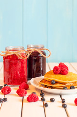 Stack of wheat golden pancakes or pancake cake with freshly