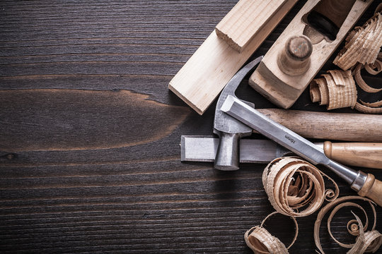 Planer claw hammer firmer chisels wooden bricks and curled shavi