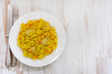 rice with meat and carrot on white plate